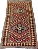 Lot#1330, NAVAJO FLAT WOVEN CARPET, C. 1890, 5' 4" X 3' 0"Featuring two central medallions on a gray ground, with red, black, cream, and brown accents. Measuring 5 ft. 4 x 3 ft. Circa 1890.