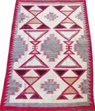 Lot#1334, NAVAJO HAND WOVEN RUG, C. 1910, 5' 1" X 3' 3"Decorated in ivory, red, grey, and tan tones. Measuring L. 5 ft. 1 x 3 ft. 3. Circa 1910.
