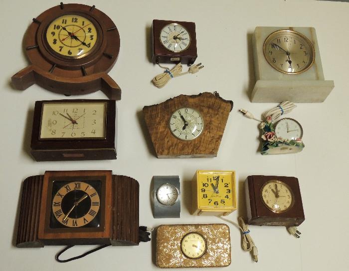 Selection from clock collection-GE, Telechron, onyx, mid-century, ship's wheel, Le Countre music box clock, more.