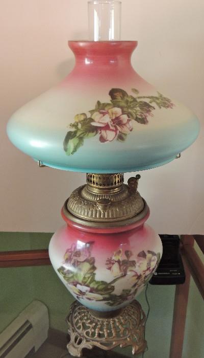 Victorian milk glass oil lamp with hand-painted magnolias, original shade, has not been electrified.