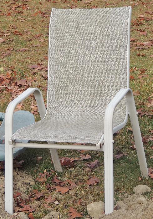 One of four chairs form patio set.