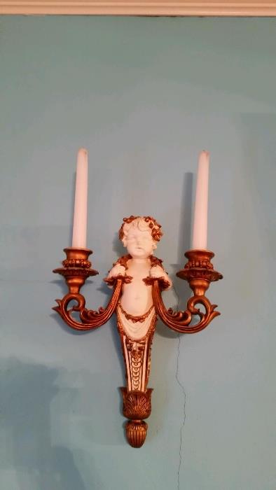 One of a pair of cherub wall sconces