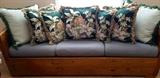 pine frame sofa with vintage fabric pillows