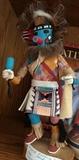 12" Kachina doll, signed. Feathers, fur, leather on doll.