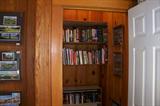 One of two closets - located in the 'sports' room - full of sports related books.