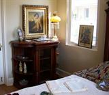 Nice mahgoany cabinet with door on the front. Shelves on each side. Another beautiful Victorian lamp with prisms.