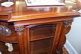 A view of the front of the Victorian cabinet. Glass is on the front of the door.