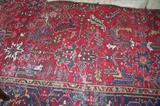 Antique oriental rug in the living room. The rug measures 11'7" by 9' wide.