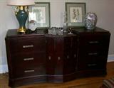 Large mahogany sideboard/cabinet.There are drawers on each side and the center doors open to shelving - suitable for a bar. A real unique piece!