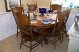 Extremely nice oak ball and claw table (with leaf) and set of 6 oak chairs - set is in excellent condition.