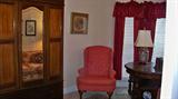 Pretty English armoire along with wing chair, library table, etc.
