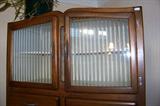 This view shows the top of the kitchen cabinet - flosted, striped door fronts - again, in excellent condition.