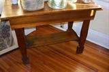 This is a wonderful antique country pine table. Note the unusual feet on this table.