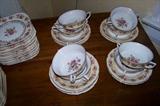 Cream soups and underplates in the "Hostess" pattern.