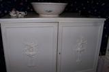 A close-up of the armoire/chest in the bedroom - note the pretty French features on the front of the doors.