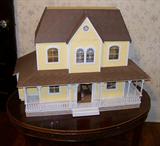 Nice vintage doll house.Assorted pieces of doll furniture included with the doll house.