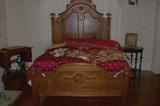 A view of the antique Victorian walnut bed.
