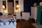 A view of the bedroom showing the French style dresser.