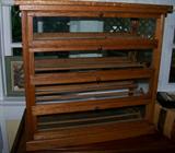 Oak ribbon cabinet - unusual piece fashioned like a barrister bookcse with each door front opening to expose the different sections for holding ribbons, etc.