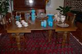 Nice oak dining room table with large reeded legs. Two leaves are showing in the table now.
