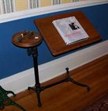 Wonderful antique oak and iron book stand with a candle rest that swivels.