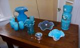 Blue art glass consisting of a large Bristol vase w/hand painted flowers; a ruffle edged hobnail bowl; two opalescent bowls/vases and a beautiful cased glass pitcher with 6 tumblers.