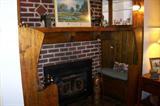 This picture shows one of the many features of this wonderful old house. The facing seats are set in front of the wood burning fireplace.