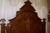 Close-up of the headboard of the Victorian bed.