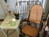 Rocker with new cane.  Side table can either be used for end table or tv stand.  And antique twin size wrought iron / brass bed with headboard / foot board / and side rails.
