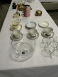 Various glassware, cups/saucers, and misc. entertainment items.