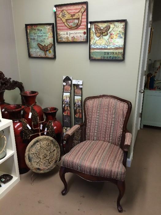 Very comfy upright upholstered chair with cane sides under arm rests.