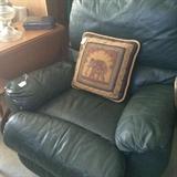               Green recliner & elephant pillow