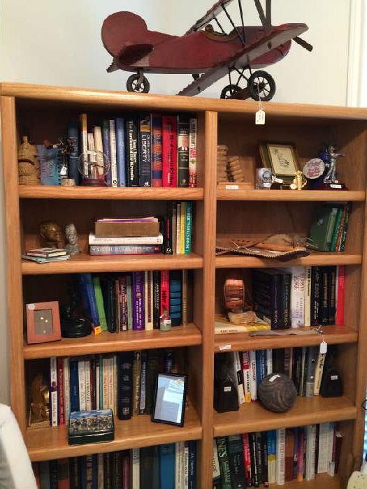    Book shelves, books, decorative wooden plane.