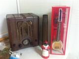 1930's Art Deco Table top Radio, old artillery casing, and other unique nick-nacks.