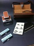 Vintage Polaroid Instant Camera with case and booklets