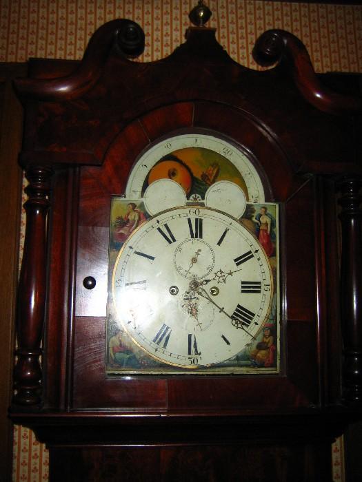 Circa 1820 Grandfather clock with moon-phase dial, mahogany case, rear of dial is signed Finnemore.