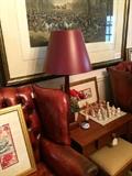         Framed art, red lamp, and chess set