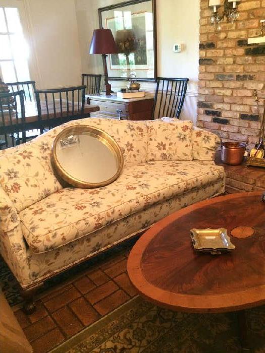          Sofa and oval inlaid wood coffee table