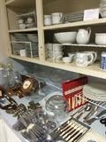         Many dishes, knife sets, and flatware