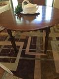  8 ft. round contemporary rug; antique round table