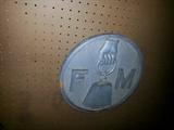 F M Embossed sign