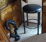 Naturalistic sculpture and small iron stool