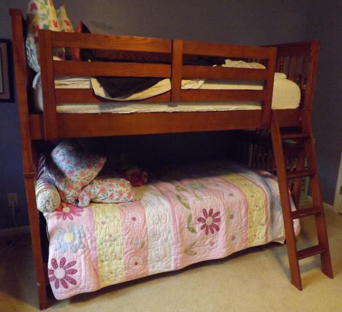 Bunk Bed
This is a wonderful twin bunk bed from the Bunk & Loft.  It is solid wood (oak).  Has a ladder and the top bunk has a piece to keep children from falling.  Does have a few scratches/dings and some tape residue (can clean off).  It does come with the mattresses.  Couldn't see if they had any stains as they are in mattresses covers, but looks to be in great shape.  The bedding is NOT included.
This bunk bed is very solid and probably need to be dismantled some what to transport.