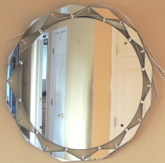 Contemporary Venetian style round faceted mirror.