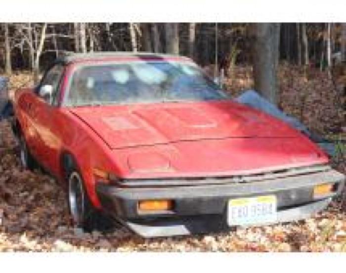 Triumph TR7. Check out this 1979 Triumph TR7 convertible in eye catching red! Four cylinder engine. Everything was in working conditon until 2 years ago when it overheated. Repairs were begun but not completed. This vehicle is ready for a new owner to give it a new lease on life! The odometer reads 87,789. This would make a awesome first car for you to fix up! Title is present. Tires will need air. This vehicle will have to be towed to it's new home so please plan accordingly.