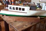 Folk home built river steamer with old motor
