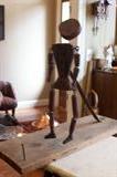 Folk art Black dancer made with old saw blade and wood