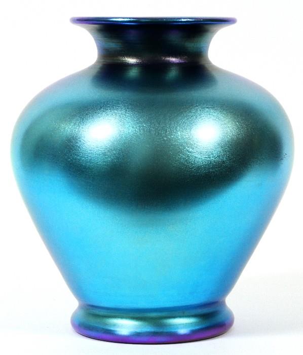 Lot#1002, STEUBEN BLUE AURENE GLASS VASE, C, 1920, H 11", DIA 9"Baluster footed form vase, polished pontil at the underside, appears to be unsigned. Measuring H. 11" x 9". Circa 1920.