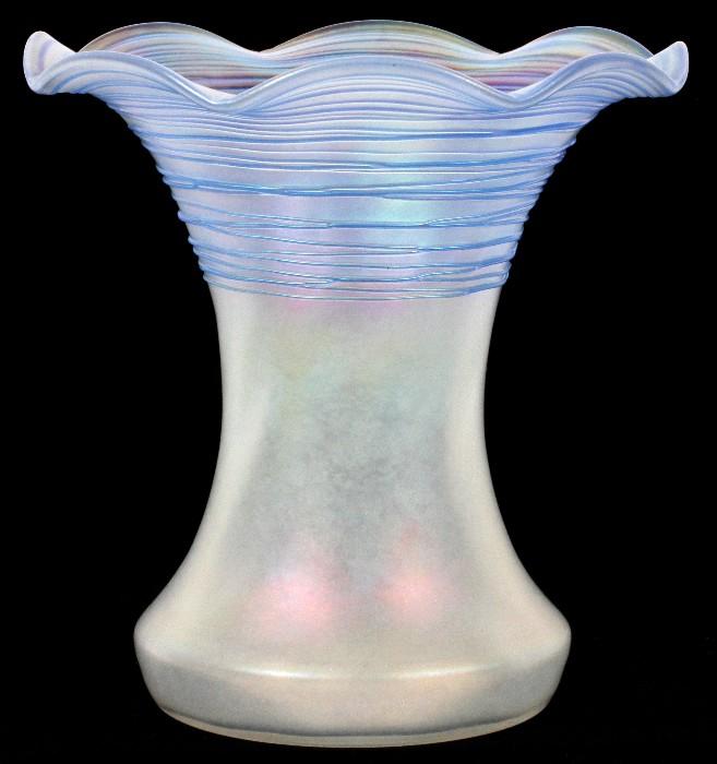 Lot#1011, STEUBEN VERRE DE SOIE GLASS VASE, C. 1915, H 6"Having a fluted rim, decorated in blue threading about the top, measuring H. 6", circa 1915.