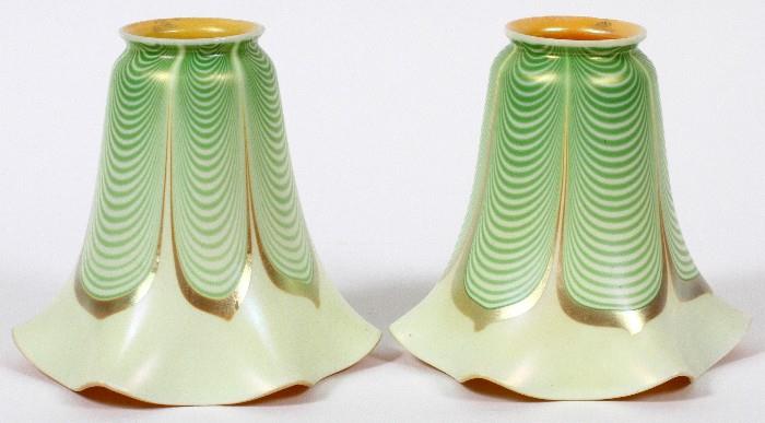 Lot#1025, STEUBEN AURENE GLASS SHADES, EARLY 20TH C., TWO, H 5 3/4"Floriform shaped, decorated in pulled feather design. Acid etch marked at the upper rims, measuring H. 5 3/4". Circa early 20th Century